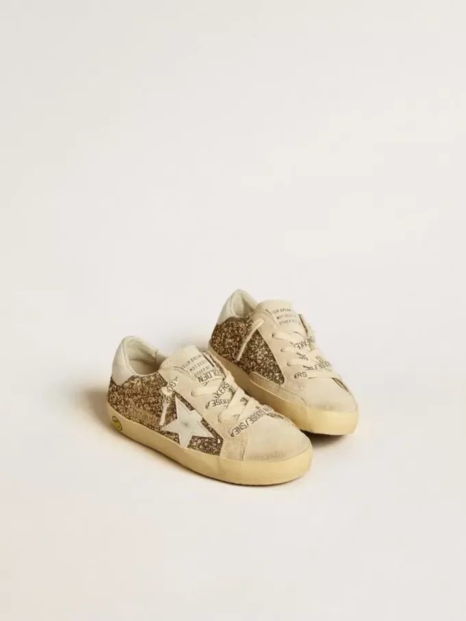 Super-Star Junior in glitter dorato con stella e linguetta sul tallone in pelle bianca