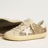 Super-Star Junior in glitter dorato con stella e linguetta sul tallone in pelle bianca