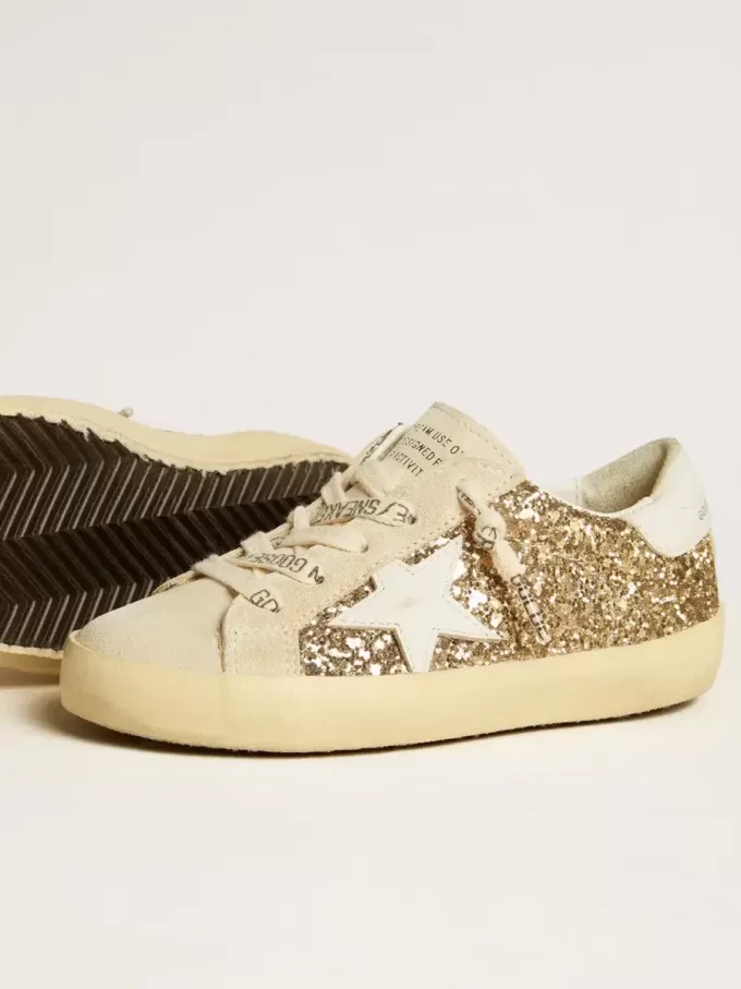 Super-Star Junior in glitter dorato con stella e linguetta sul tallone in pelle bianca