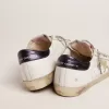 Super-Star LTD da donna con linguetta blu sul tallone e stella in cristallo Swarovski Super-Star LTD da donna con linguetta blu sul tallone e stella in cristallo Swarovski