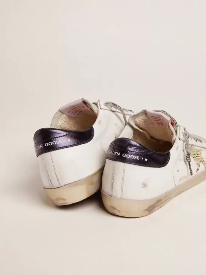 Super-Star LTD da donna con linguetta blu sul tallone e stella in cristallo Swarovski Super-Star LTD da donna con linguetta blu sul tallone e stella in cristallo Swarovski