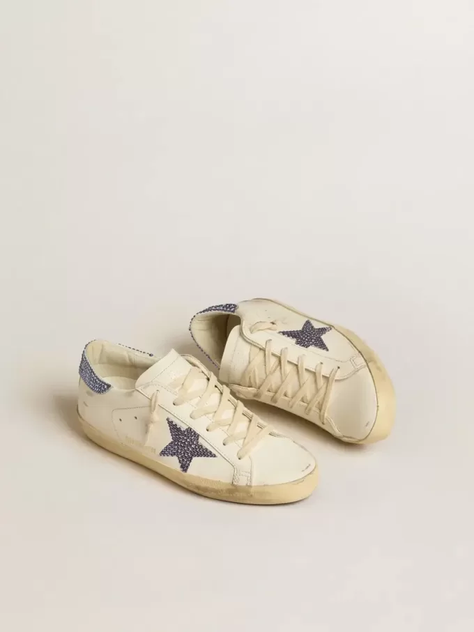 Super-Star LTD da donna con stella in pelle scamosciata e linguetta sul tallone con cristalli Swarovski Super-Star LTD da donna con stella in pelle scamosciata e linguetta sul tallone con cristalli Swarovski