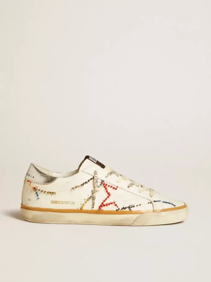 Super-Star LTD da donna con stella traforata e linguetta sul tallone in pelle metallizzata Super-Star LTD da donna con stella traforata e linguetta sul tallone in pelle metallizzata