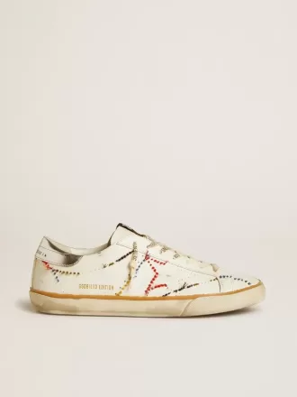 Super-Star LTD da uomo con stella traforata e linguetta sul tallone in pelle metallizzata Super-Star LTD da uomo con stella traforata e linguetta sul tallone in pelle metallizzata