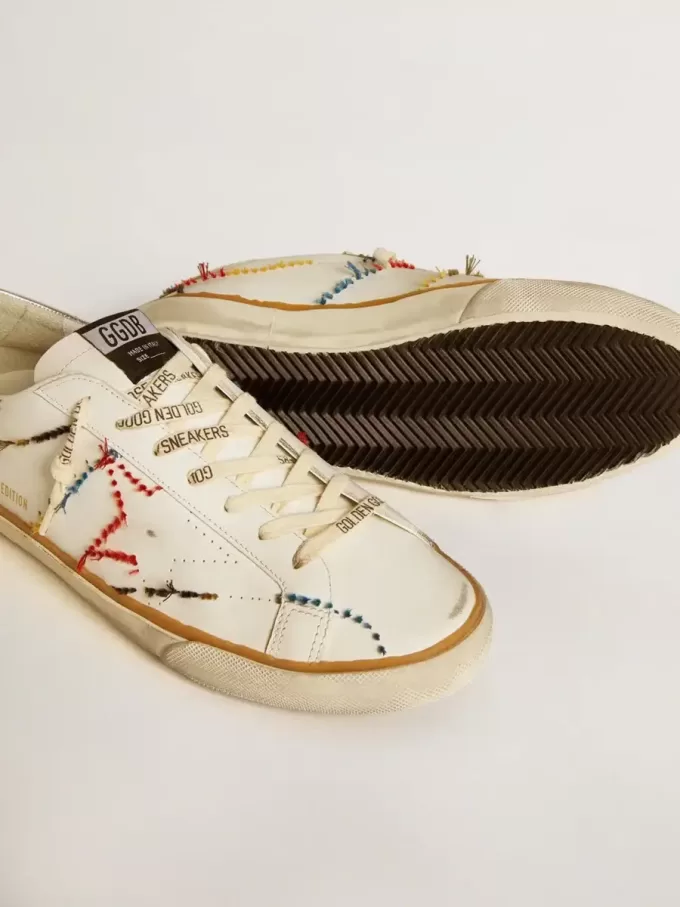 Super-Star LTD da uomo con stella traforata e linguetta sul tallone in pelle metallizzata Super-Star LTD da uomo con stella traforata e linguetta sul tallone in pelle metallizzata
