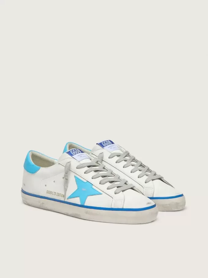 Super-Star LTD da uomo in pelle bianca con stella e linguetta sul tallone in pelle azzurra Super-Star LTD da uomo in pelle bianca con stella e linguetta sul tallone in pelle azzurra