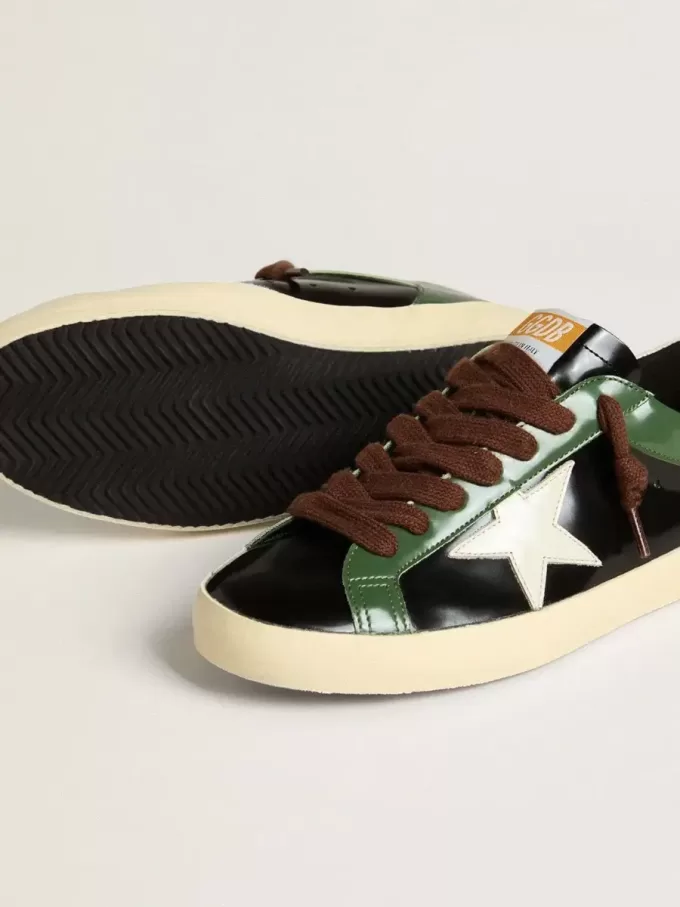 Super-Star LTD da uomo in pelle laminata nera con stella e linguetta sul tallone in pelle bianca Super-Star LTD da uomo in pelle laminata nera con stella e linguetta sul tallone in pelle bianca