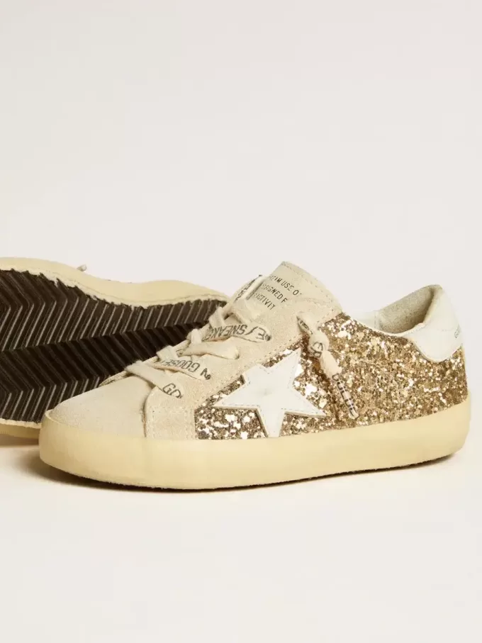Super-Star Young in glitter dorato con stella e linguetta sul tallone in pelle bianca Super-Star Young in glitter dorato con stella e linguetta sul tallone in pelle bianca
