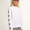 T-shirt bianca a maniche lunghe con stelle nere a contrasto