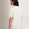 T-shirt bianca da donna con cristalli cabochon T-shirt bianca da donna con cristalli cabochon
