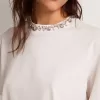 T-shirt bianca da donna con cristalli cabochon T-shirt bianca da donna con cristalli cabochon