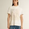 T-shirt bianca da donna con stampa floreale T-shirt bianca da donna con stampa floreale
