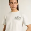 T-shirt bianca da donna con stampa nera sul petto T-shirt bianca da donna con stampa nera sul petto