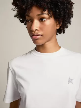 T-shirt bianca da donna con stella glitterata argento sul davanti