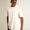 T-shirt bianca da uomo con trattamento effetto consumato T-shirt bianca da uomo con trattamento effetto consumato