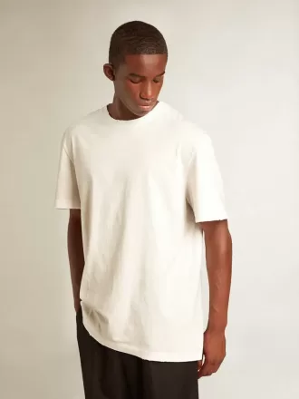 T-shirt bianca da uomo con trattamento effetto consumato T-shirt bianca da uomo con trattamento effetto consumato