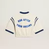 T-shirt corta in cotone bianco invecchiato con scritta sul retro T-shirt corta in cotone bianco invecchiato con scritta sul retro