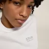 T-shirt da donna bianca con logo glitterato argento e stella T-shirt da donna bianca con logo glitterato argento e stella