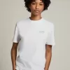 T-shirt da donna bianca con logo glitterato argento e stella T-shirt da donna bianca con logo glitterato argento e stella