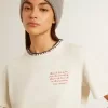 T-shirt da donna in cotone bianco invecchiato con ricami fatti a mano