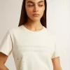 T-shirt da donna in cotone bianco invecchiato con stampa e ricamo
