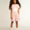 T-shirt rosa da bambina con logo bianco e maxi stella T-shirt rosa da bambina con logo bianco e maxi stella