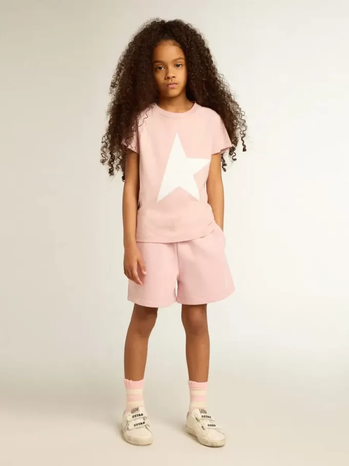 T-shirt rosa da bambina con logo bianco e maxi stella T-shirt rosa da bambina con logo bianco e maxi stella