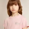 T-shirt rosa da bambina con logo glitterato argento e maxi stella T-shirt rosa da bambina con logo glitterato argento e maxi stella