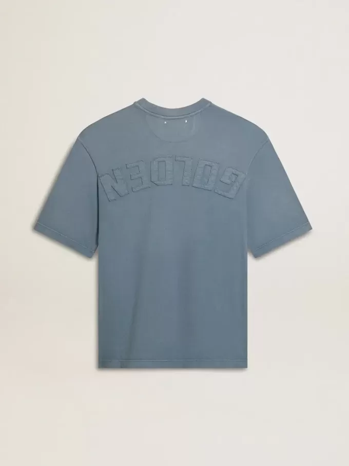 T-shirt unisex in cotone azzurro con stampa rovesciata sul retro T-shirt unisex in cotone azzurro con stampa rovesciata sul retro