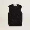 Top in maglia nera con paillettes e dettagli a contrasto