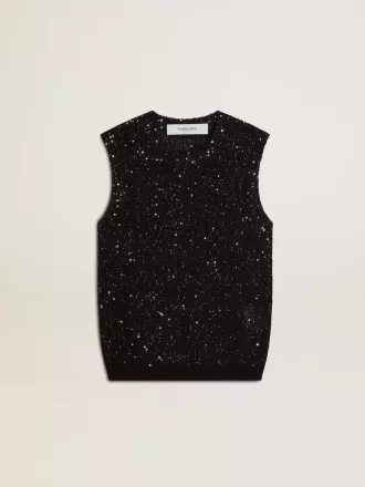 Top in maglia nera con paillettes e dettagli a contrasto