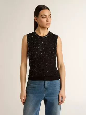 Top in maglia nera con paillettes e dettagli a contrasto