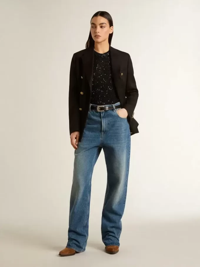 Top in maglia nera con paillettes e dettagli a contrasto