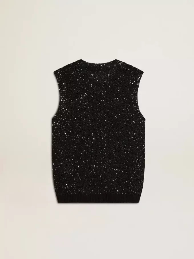 Top in maglia nera con paillettes e dettagli a contrasto