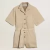 Tuta da donna in denim beige con cintura e orlo sfrangiato