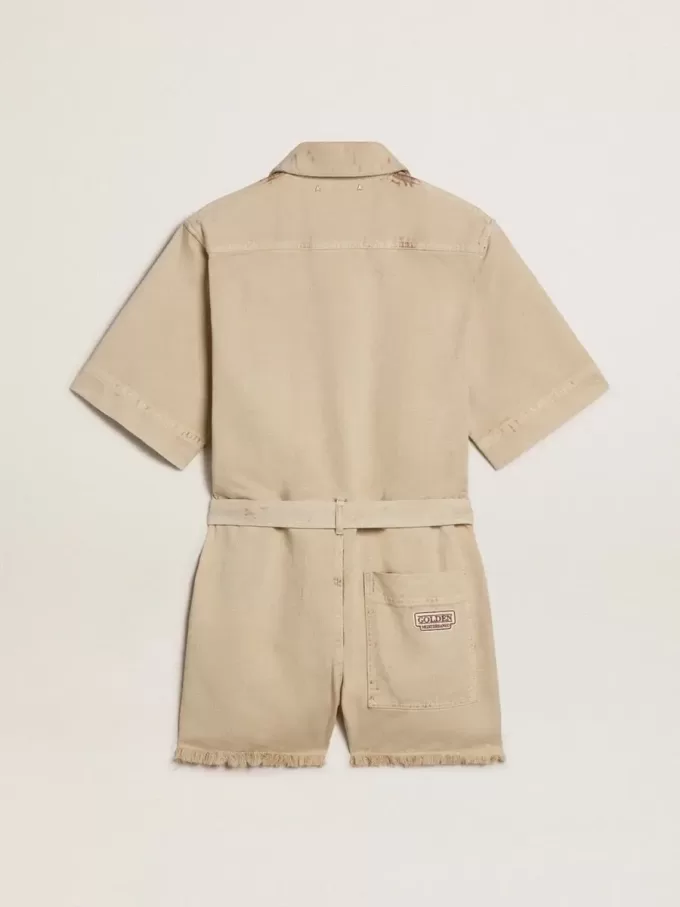 Tuta da donna in denim beige con cintura e orlo sfrangiato