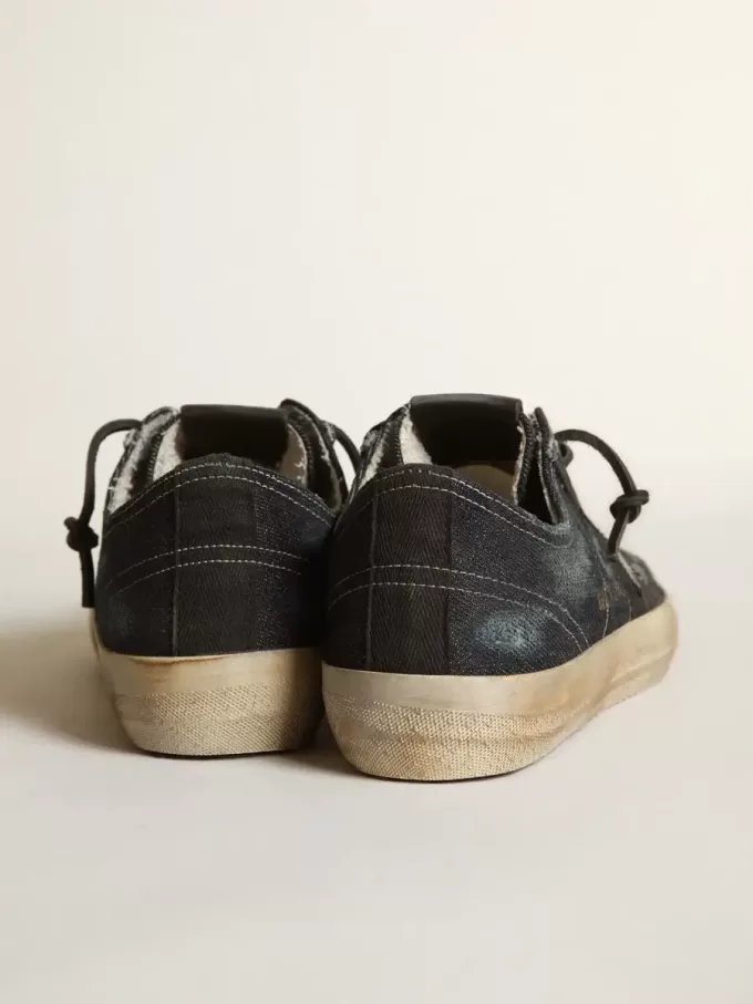 V-Star in denim blu notte con stella e puntale in pelle nera