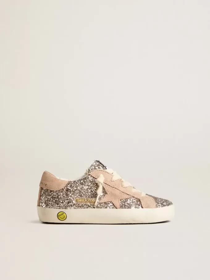 Young Super-Star glitterata con stella in pelle scamosciata e linguetta sul tallone