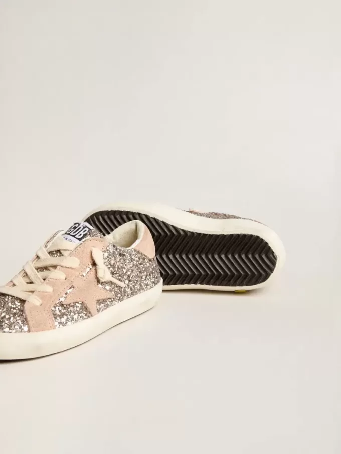 Young Super-Star glitterata con stella in pelle scamosciata e linguetta sul tallone